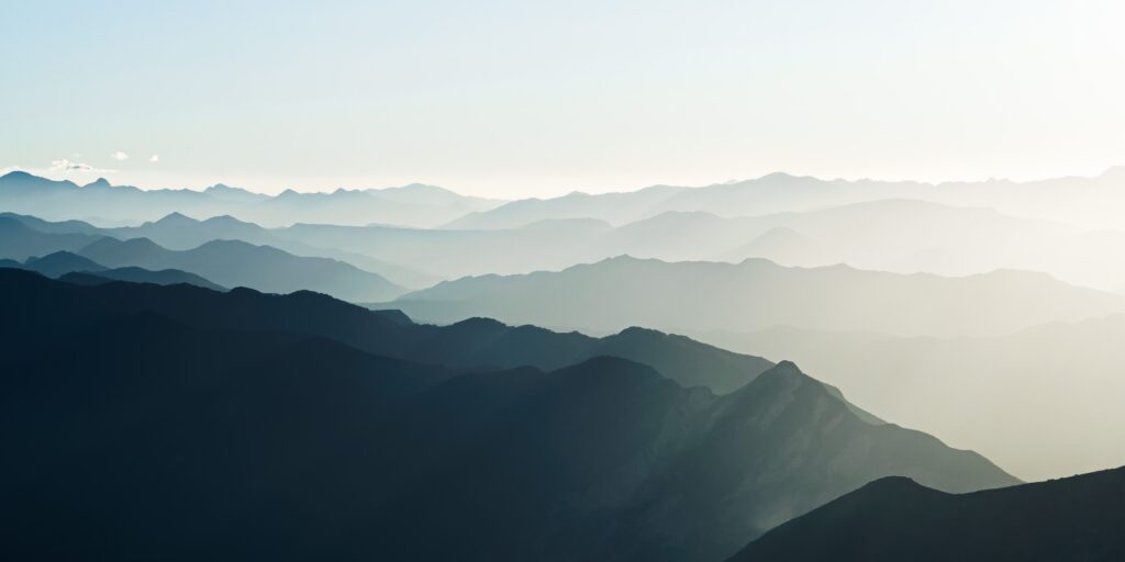 Breathtaking aerial view of the misty mountain ranges in Santiago de Querétaro, Mexico at dawn.